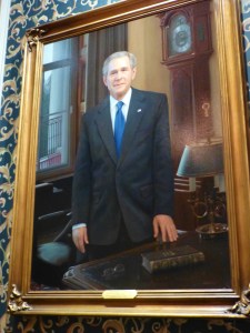 This portrait of President Bush hangs over the mantel in the U.S. President's gallery.  It is unbelievably life-like and looks like a photograph!