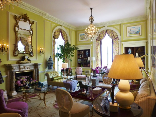 Mrs. Blair's Drawing room is a colorful exotic retreat.   The chartreuse walls invigorate the space with a spring-time feel and the colorful fabrics are so youthful and vibrant!