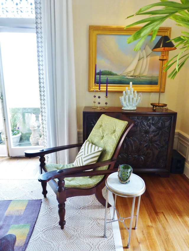 The back seating area features some lovely British Indies style furniture which is crafted from beautiful dark wood (hardwoods like teak and mahogany were often used to prevent warping in the high humidity).  These specific 'Plantation or Planter's Chairs' were designed with arms that swivel out to support swollen legs (so the plantation owner could remove his high boots).  Such a cool piece of furniture, isn't it?