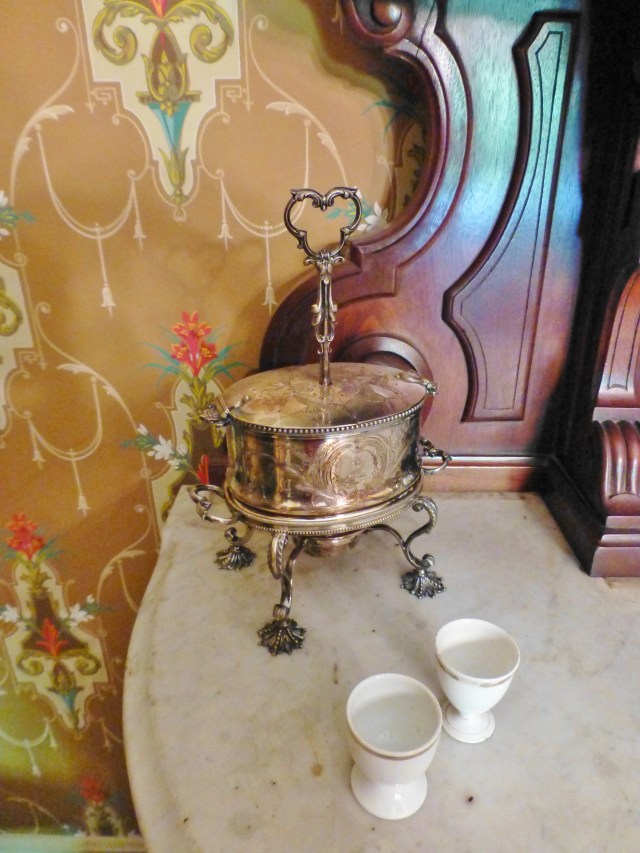 This silver egg warmer is one of my favorite things in the dining room. I just love different and unusual Victorian serving pieces. Those Victorians were so clever about this sort of thing!