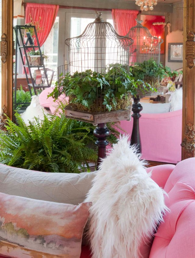 Featured plants in the sunroom were ferns, ivy, and succulents.  Here you can see a close-up of the hand-painted pillow I used on the settee.  It mimics the view of the pond out the window. 