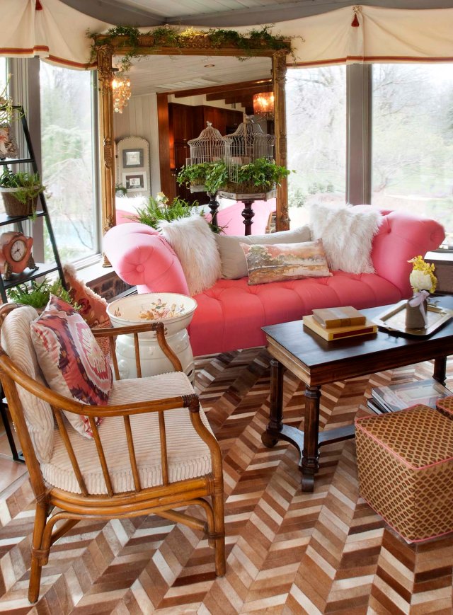 Here you'll notice the magnificent Victorian mirror, which anchors the sitting area in the corner.  The tufted coral linen settee is a comfy place to relax with its fluffy pillows.  The coffee table is a re-purposed Victorian piano bench (the perfect size for this spot) and a pair of small custom slipcovered ottomans are seen in the foreground .