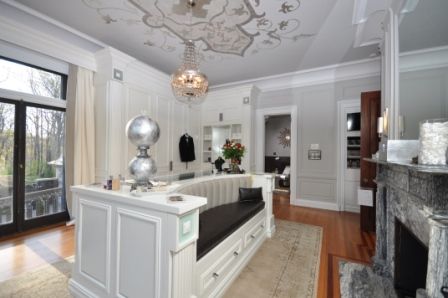 This image is from a Press Release by Affordable Closets Plus, which you can read by clicking on this image.  You can see the whole room here, with its double sided seating and the grey veined fireplace mantel