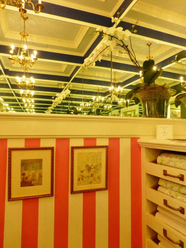 Here's another detail, showing the wide pink awning stripe adjacent to the pull-out shelves for storing linens.  What a fantastic closet, featuring the illusion of never-ending space.