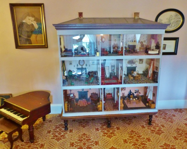Here you see the quite large (around 5 foot tall) dollhouse, filled with antique miniature furnishings.  Sorry about the glare, but the museum keeps plexiglass on the front for obvious reasons--who could resist reaching a hand inside to play with these little masterpieces?  