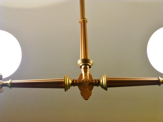 Here's a closer look at the kitchen's light fixture, and the beautiful starburst detail at the center.  I could see this used in one of my client's homes today, above a modern kitchen island.