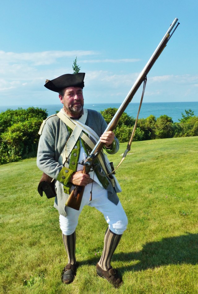 Each gentleman creates his own attire. I particularly liked the striped stockings and bright green wool trim on this man's costume. Can you see how big that musket is? They are heavy!!