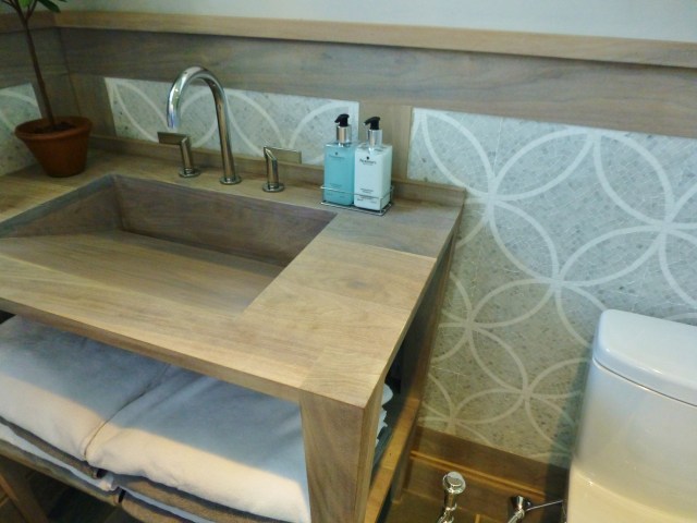 The wood vanity was so cool in this bathroom.  I just loved the beachy bleached finish and the extremely simple lines of everything.  It's also great how the woodwork on the walls coordinate with the custom sink base. 