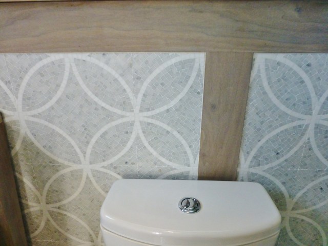 Here's a closeup of the absolutely stunning mosaic tiles on the walls of the guest house bathroom.  I just love how this gives the room interest and texture in a traditional, almost classical Grecian way.