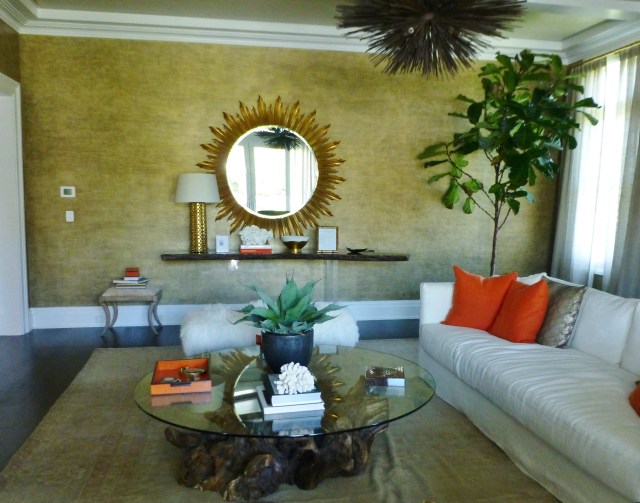 Off to the left is this fabulous Lucite console with a live-edge wood top.  The starburst mirror is fantastic too!