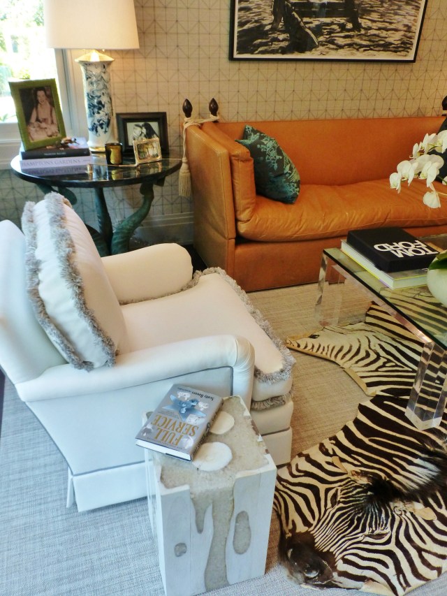The ivory club chairs feature brush fringe along the cushion seams.  Notice the sisal area rug is layered with a real Zebra hide rug.  Animal skins were a popular recurring theme in this year's designer showhouse.