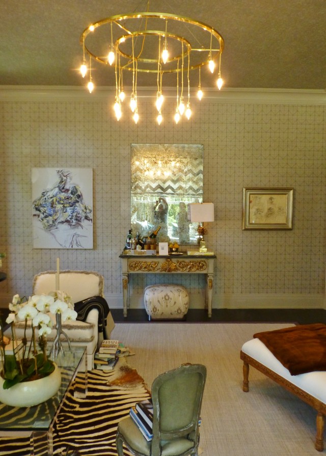 Across the room is an ornate, painted and gilded console table with an antiqued mirror above.  Beautiful antiqued mirrors were another recurring motif at the 2014 Hampton Designer Showhouse.