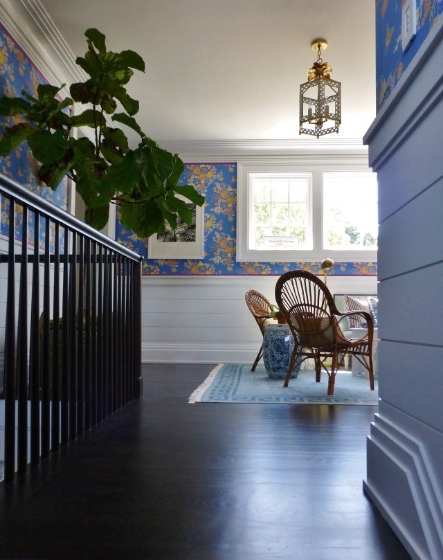 Climbing the stairs, you are greeted by the light streaming through the windows in the second floor stair landing, highlighting the gleaming hardwood floors.  One of the first things you'll notice is the gorgeous floral fabric upholstering the walls above the ship-lap wainscoting.  