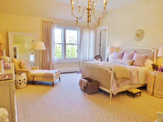Kate Singer is quoted as saying, "I wanted this bedroom to have a peaceful, tranquil feel inspired by the soft and serene color palette of summer lilacs, linen and white.  This would be a wonderful room in which to retire at the end of a day at the beach or shopping in town."