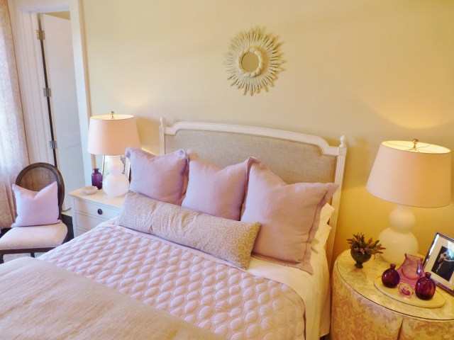 I'll leave you with this shot of the bed and its pretty side chair, bedding, and charmingly mismatched night stands. 