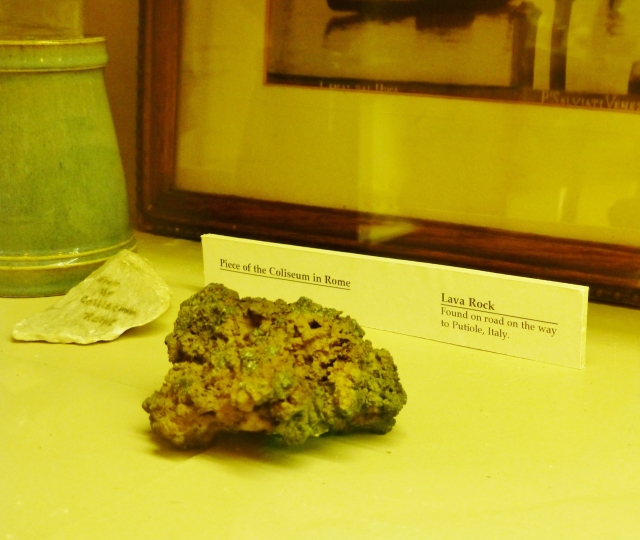 The objects in the cases are widely varied.  For instance, this image is of an ancient lava rock and a fragment of the Coliseum in Rome.