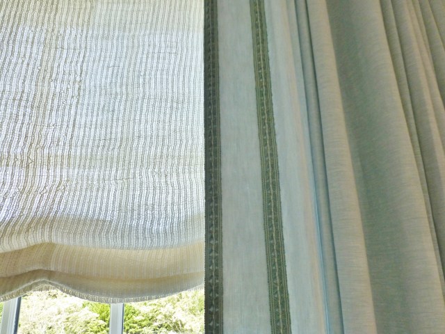 Here is a detail of the fabrics and trims on the sumptuous window treatments in this elegant bedroom.