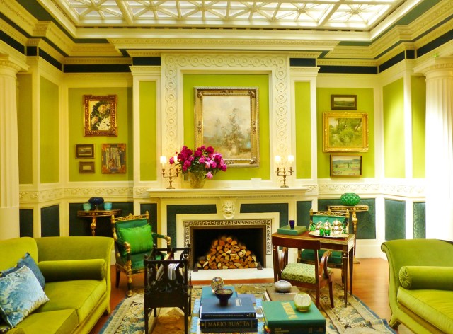 The atrium features a beautiful glass ceiling and is open to the hallways on 3 sides. James Yarosh chose a vivid green, combined with peacock blue for the vibrant color scheme.