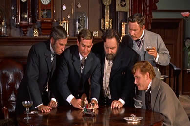 The 1960 movie, The Time Machine by H.G. Wells, was one of our inspirations to begin collecting antique clocks. This image from the beginning of the film shows the main character's study which has walls covered in all manner of clocks.   So cool!
