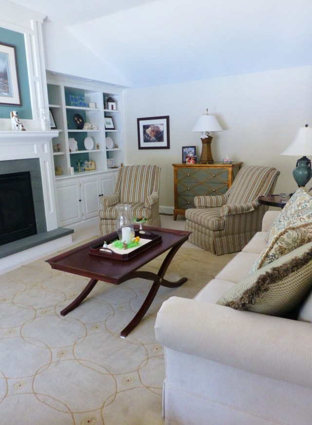 Soothing colors with contrast blue-grey inside the bookcases and above the fireplace mantel create a sense of calm elegance in my client's great room.