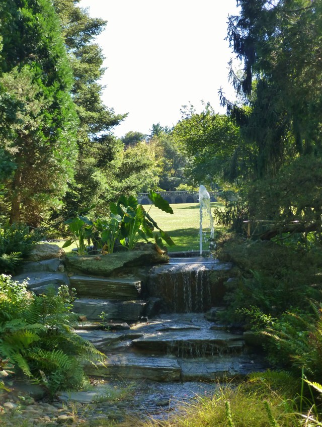 There are many fountains and sculptures in the 92 acres that encompass the Morris Arboretum. Here you see the Key Fountain with the Seven Arches bridge in the distance across the large field of the English Park.