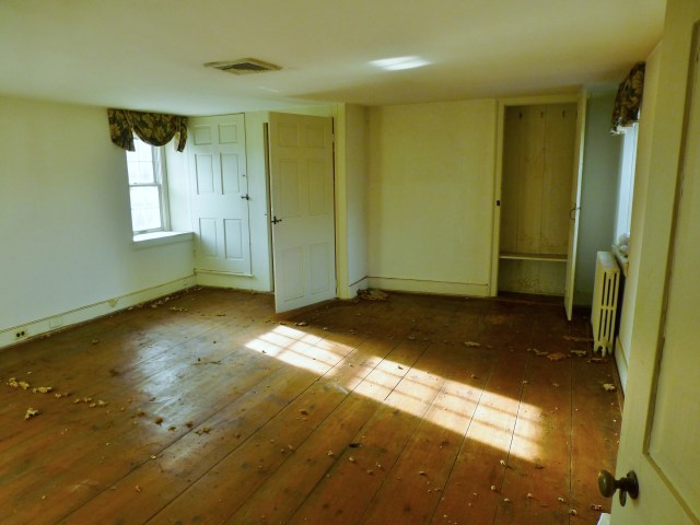 Here's the BEFORE view upon entering my bedroom at the Bucks County Designer House. As you can see, the room is in quite a state! The wall opposite the entrance has an attic door (on the left), a cedar closet under the stair, then a small nook of wall space and another shallow closet on the right. 