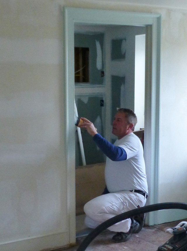 Here's a photo of Michael Howard, of The Perfect Hangup, beginning the painting in my Bucks County Designer House bedroom. I'm so excited to see the transformation finally begin!