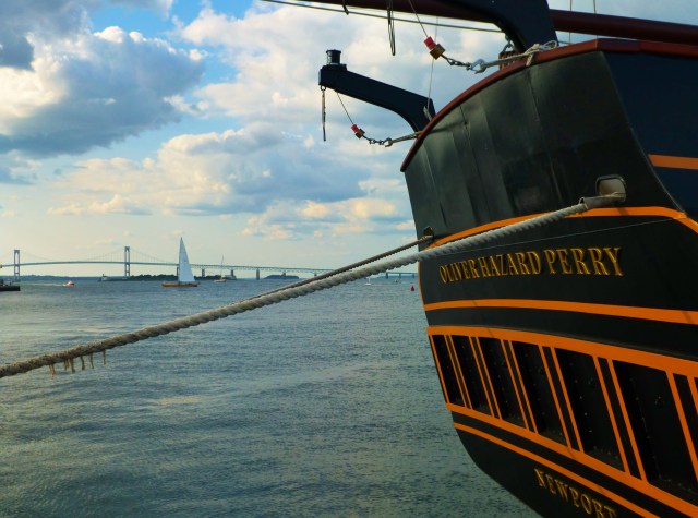 Oliver Hazard Perry in the foreground with Newport RI Bridge and Sailboat